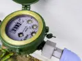 Zielony wodomierz z widocznym licznikiem 0013.19 m³. Zastanawiasz się, ile kosztuje wymiana wodomierza?