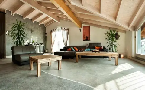 Nowoczesny salon z podłogą z żywicy. Sprawdź podłoga z żywicy cena za metr, by stworzyć podobne wnętrze.